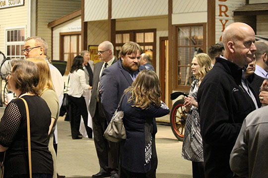 Photo of people mingling at the MCAS President's Reception at the Western Development Museum